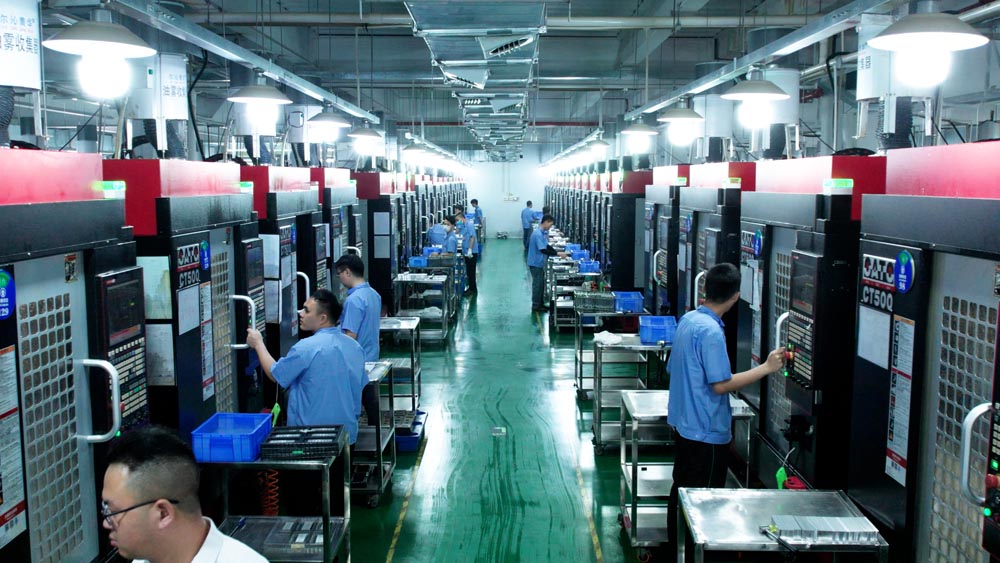 Rows of CNC machining centers in operation